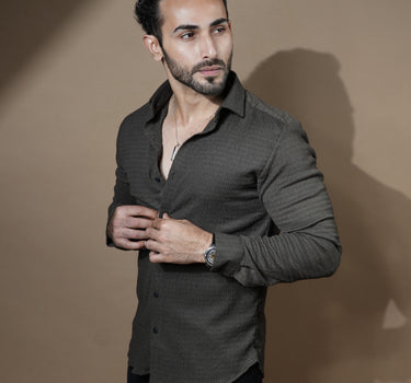 Causual body fit tapered brown shirt with black trousers.