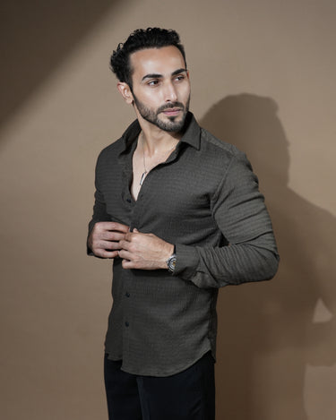 Causual body fit tapered brown shirt with black trousers.