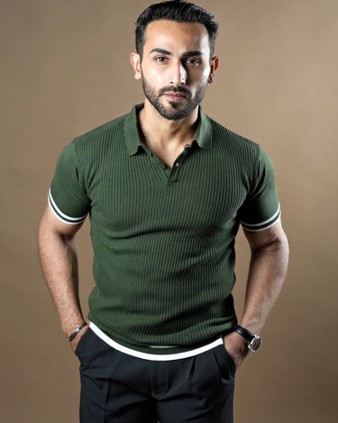 Textured knitted polo dark green T-shirt with black trousers.