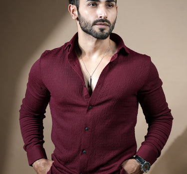 Causual body fit tapered jacquard wine shirt with black trousers.