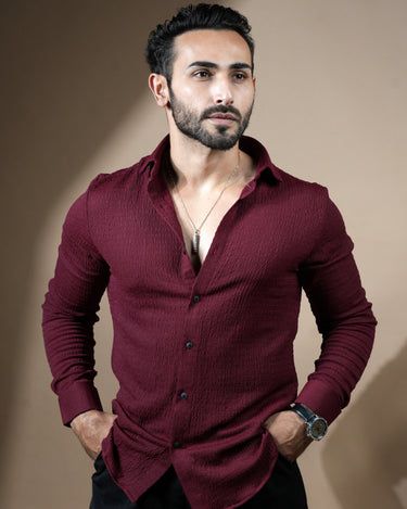 Causual body fit tapered jacquard wine shirt with black trousers.