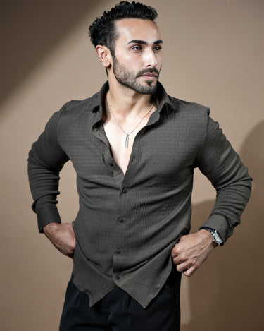 Causual body fit tapered brown shirt with black trousers.