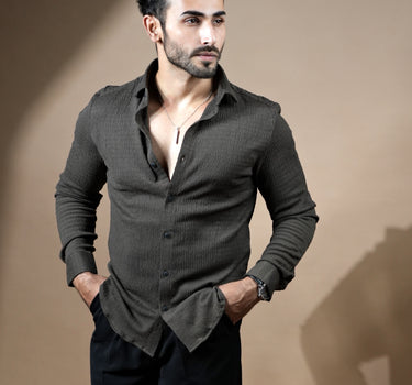 Causual body fit tapered brown shirt with black trousers.