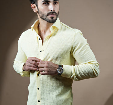 Causual body fit tapered lemon shirt with black trousers.