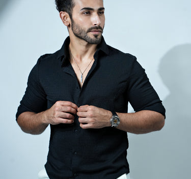 Causual body fit tapered black shirt with white trousers.