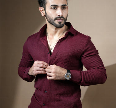 Causual body fit tapered jacquard wine shirt with black trousers.