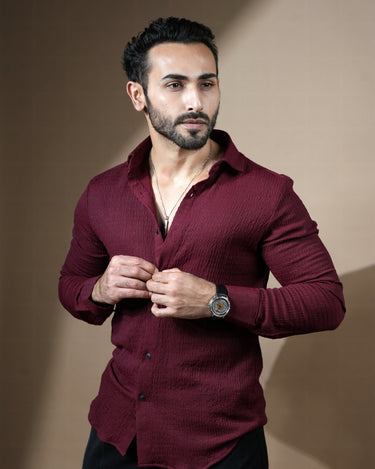 Causual body fit tapered jacquard wine shirt with black trousers.